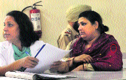 Neena Sharma (right) during a medical check-up at the Civil Hospital in Mohali on Monday. 