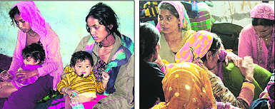 Two women, who lost their husbands in the cloudbursts, at a relief camp in Government Inter-College at Ukhimath in Rudraprayag on Monday; and (right) bereaved 