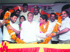 Chief Minister Vijay Bahuguna with his son Saket Bahuguna at a public meeting at Nainbagh near Mussoorie.