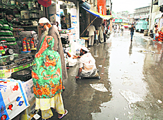 A market wears a deserted look after rain lashed Srinagar and its surrounding areas on Monday. More rain is forecast during the next 24 hours.