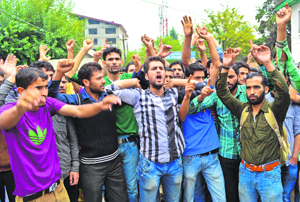 NYC volunteers during a protest against the state government in Srinagar on Monday.