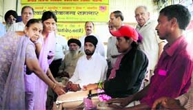 Members of the Bharat Vikas Parishad distribute artificial limbs among the differently abled in Ludhiana.