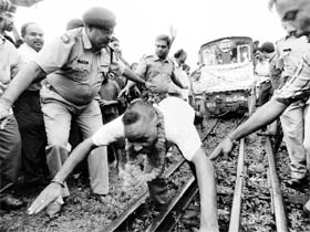 Guinness World Record holder Shailendra Nath Roy pulls the Darjeeling Toy Train wiith his ponytail in Siliguri on Monday.