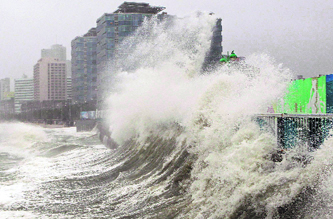High waves caused by Typhoon Sanba crash on Haeundae beach in Busan, south of Seoul, on Monday.