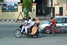 Commuters on this bike ride without caring for safety or traffic rules