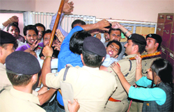 A scuffle takes place between policemen and NSUI workers in the office of the Principal, DAV (PG) College, in Dehradun on Tuesday. Tribune photo: Vinod Pundir