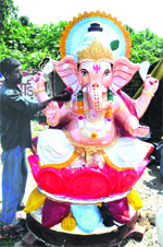 An artiste gives the finishing touches to the idol of Lord Ganesha at Bhagat Singh Chowk in Haridwar on Tuesday. Tribune photo: Rameshwar Gaur