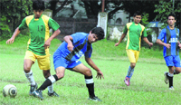 A match in progress during the Dehradun District Football League in Dehradun on Tuesday. Tribune photo: Vinod Pundir