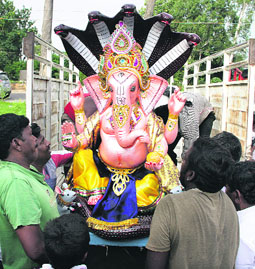 As pooja for Ganesh Chaturthi begins today, devotees take home an idol in Jalandhar on Tuesday.