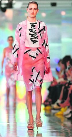 Peaches and pink: A model presents a creation from the Christopher Kane Spring/Summer 2013 collection at London Fashion Week.