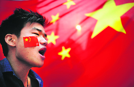 A demonstrator shouts slogans during a protest