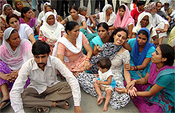 The wife and family members of the deceased youth protesting against the police on the premises of the district hospital in Moga on Wednesday