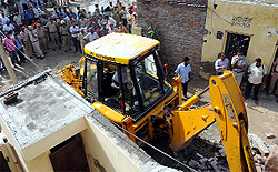 The police and the MCB team removing the encroachment from street number 2 of Gopal Nagar on Wednesday