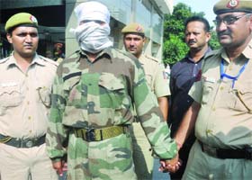 Police takes accused Dharmendar Kumar to court from the police headquarters in New Delhi on Wednesday