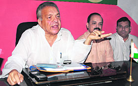 Aslam Khan, in charge of the Uttarakhand unit of the Samajwadi Party, addresses a press conference in Dehradun.