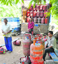 LPG distributers await delivery of cylinders in Jammu on Wednesday.