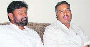 NC Goyal, Divisional Railway Manager , Ferozepur division, Northern Railway, with Choudhary Lal Singh, Member of Parliament, from Kathua-Udhampur-Doda Parliamentary constituency during a press conference in Jammu on Wednesday.