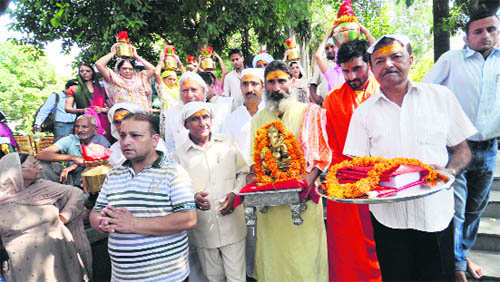 Devotees celebrate Ganesh Chaturthi in Jammu on Wednesday. 
