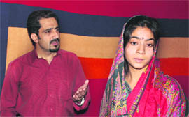 Artistes enact a scene from Grand Rehearsal, a play, at the SKICC auditorium in Sringar on Wednesday.