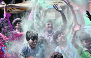 Devotees play with colours on the first day of Ganesh Chaturthi in Ludhiana on Wednesday.
