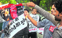 A protest against the UPA government in New Delhi on Wednesday. Tribune photo: Manas Ranjan Bhui