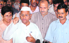 Anna Hazare, Arvind Kejriwal and Kiran Bedi in New Delhi. Tribune photo: Mukesh Aggarwal