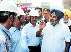 Deputy Chief Minister Sukhbir Badal with Chinese engineers at the Banawali thermal power project in Mansa on Wednesday