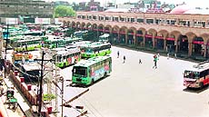 The bus stand wears a deserted look; and (right) shops lie closed in Amritsar on Thursday. 