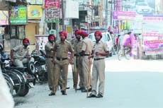 Policemen keep vigil in the city during the Bharat Bandh called by the NDA on Thursday. 