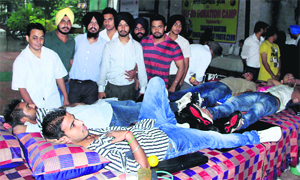 Volunteers donate blood at a camp organised by the Shaheed Kartar Singh Sarabha Youth Club at the Mata Basani temple in Chandigarh.