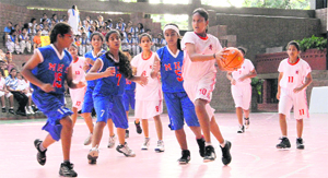 A match in action during the All-India Girls' Basketball Championship in Dehradun on Thursday.