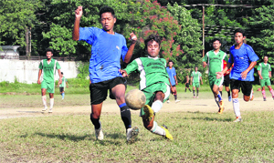 Players in action during the District Dehradun Football League in Dehradun on Thursday. 