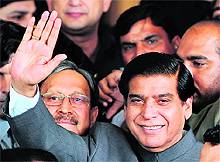Pakistan Prime Minister Raja Pervez Ashraf waves to his supporters in Islamabad