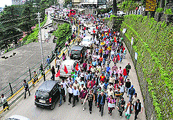 CPM activists organise a chakka jam during a Bharat bandh in Shimla on Thursday