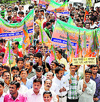 BJP activists protest against the UPA government in Dharamsala on Thursday