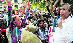 CPM leader MY Tarigami (right) and other party workers raise anti-government slogan during a protest in Srinagar on Thursday
