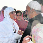 A woman pilgrim being seen off by her family members at the Srinagar Airport. A Tribune photograph 