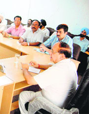 Mayor Bakshi Ram Arora in a meeting with officials of the MC in Amritsar on Friday