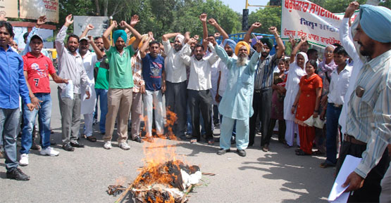 Demanding jobs, unemployed linesmen stage protest near the bus stand in Bathinda on Friday.Tribune photo: Pawan Sharma