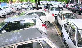 Vehicles parked on the yellow line in violation of the rules at the CMC parking lot in Sector 17, Chandigarh.