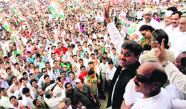Congress candidate for the Tehri byelection Saket Bahuguna waves at party supporters before filing his nomination papers at Parade Ground in Dehradun on Friday.