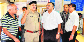 SP, City, Kiran Lal Shaw inspects security measures at a branch of the State Bank of India at Mayapur in Haridwar on Friday.