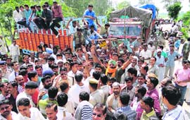 Manglora villagers block the Karnal-Meerut highway on Friday. 