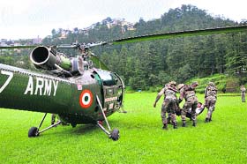 Army personnel participate in a mock drill at the Annandale ground in Shimla on Friday