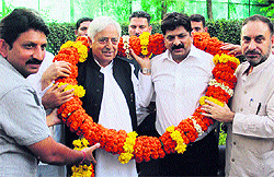 PDP patron and former Chief Minister Mufti Mohd Sayed welcomes newly-elected chairman of Jammu Citizens' Cooperative Bank Ltd Dinesh Gupta into the party fold in Jammu on Friday