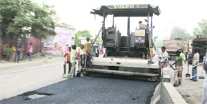 The road along Rama Mandi Chowk being re-laid in Jalandhar on Friday.