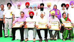The award-winning farmers at the university in Ludhiana on Friday
