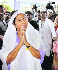 West Bengal CM Mamata Banerjee greets pilgrims at Haj House in North 24 Parganas district, West Bengal, on Friday.