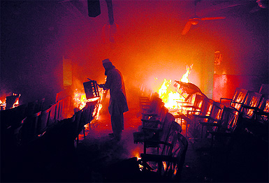 Fire engulfs a cinema hall during a protest against an anti-Islam film in Peshawar