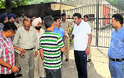 Officials of the Chandigarh Administration soon after the sealing of the premises of the Central Club at Sector 9 in Chandigarh on Saturday